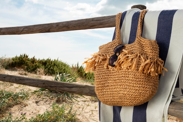 Beach bag with essentials still life