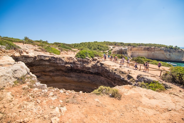  Beach cave of Benagil in Carvoeiro, a popular tourist attraction considered one of the most beautiful beaches of the world. Travel and vacation destinations