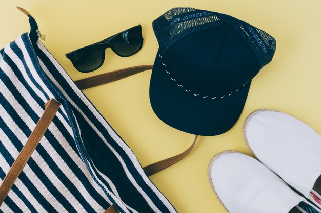 Beach equipment on yellow background