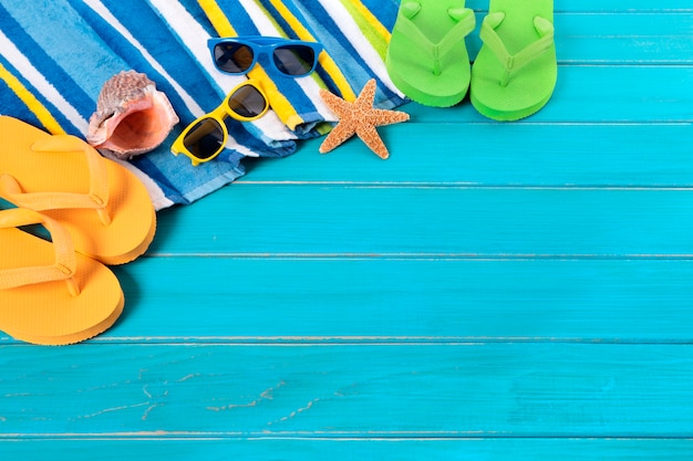 Beach items above a blue plank