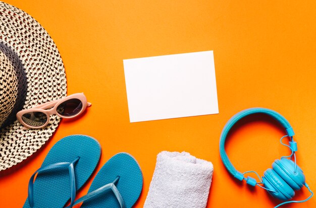 Beach marine items and sheet of paper on bright background