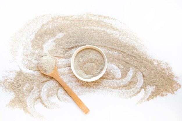 Beach sand with bowl and spoon