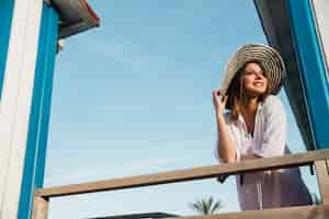 Free photo beach and summer concept with woman and sky