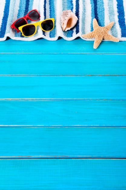 Beach towel over a blue wooden floor