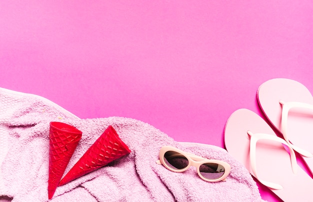 Beach vacation composition on pink background