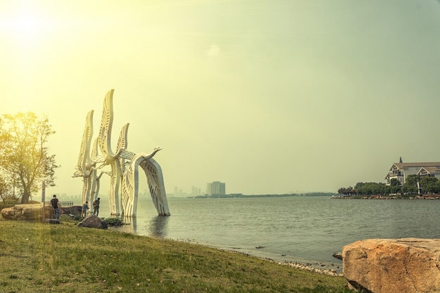 Beach with giant sculptures of pigeons