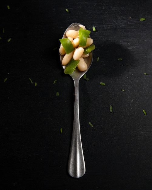 Beans and salad in a spoon