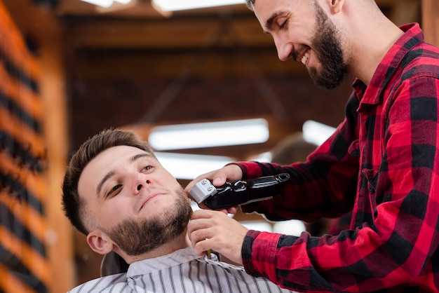 Beard styling and cut in a barber shop