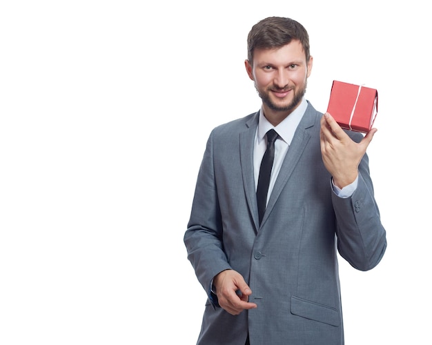 Bearded businessman holding a present