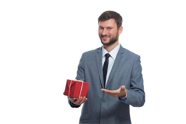 Bearded businessman holding a present