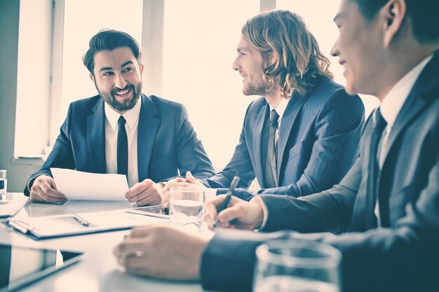 Bearded businessman holding a report