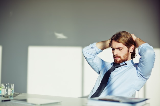 Bearded businessman thinking