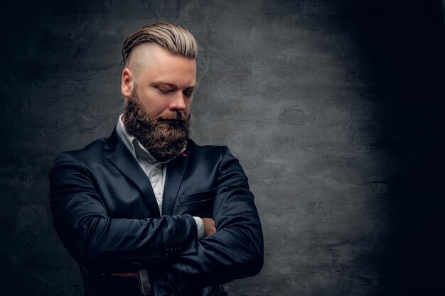 Bearded hipster male in purple suit isolated  on grey vignette background.