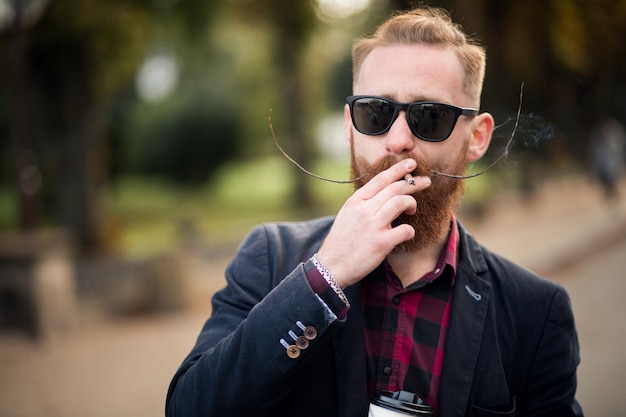 Free photo bearded man smoking