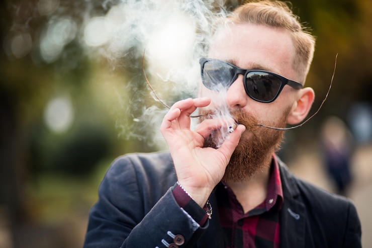 Free Photo bearded man smoking
