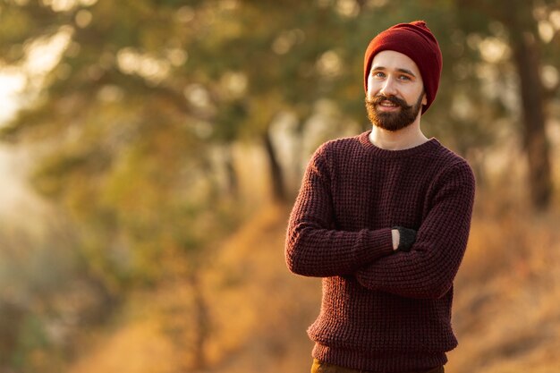 Bearded man staying in nature