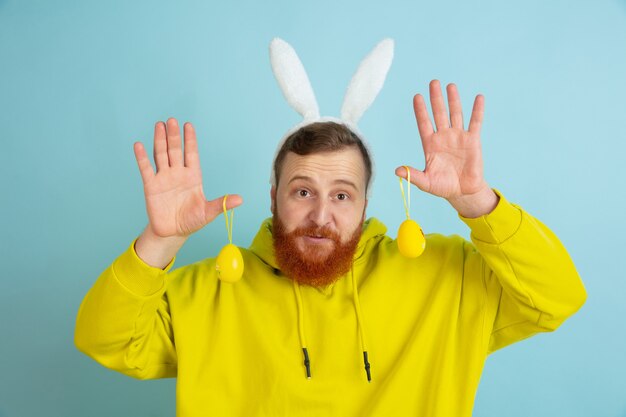 Bearded man with bunny ears for Easter