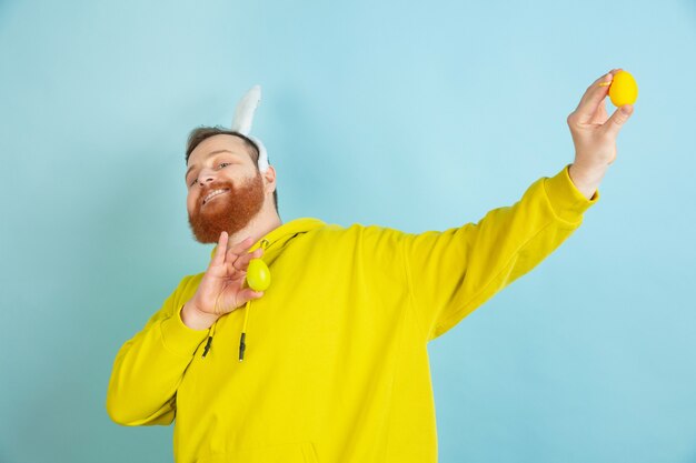 Bearded man with bunny ears for Easter