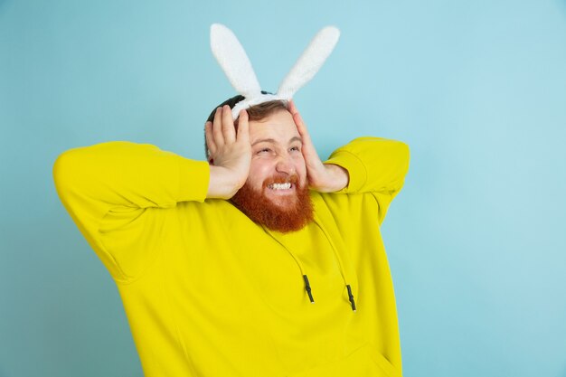 Bearded man with bunny ears for Easter