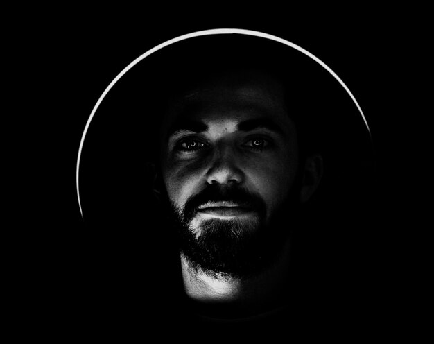 Bearded man with light circle around head