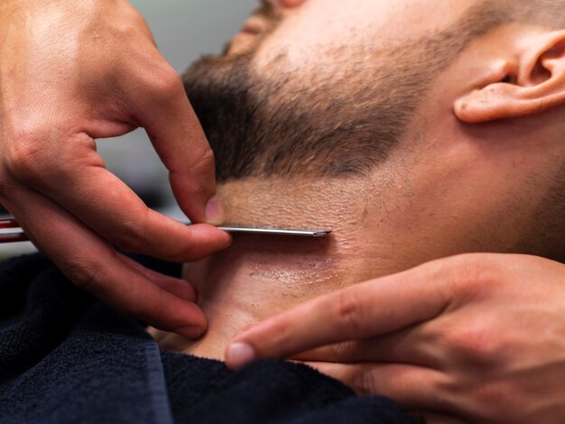 Bearded man with a razor blade