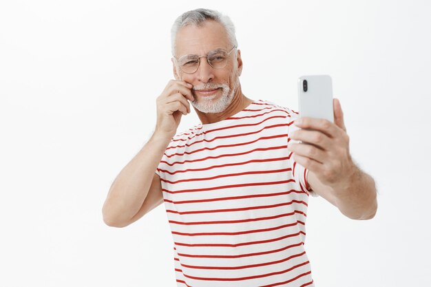 Bearded old man in striped Tshirt