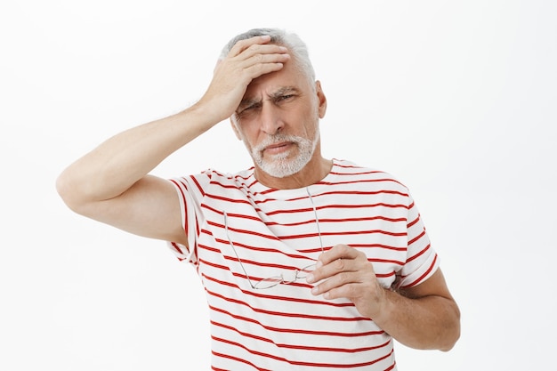 Bearded old man in striped Tshirt