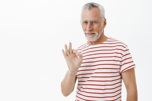 Bearded old man in striped Tshirt