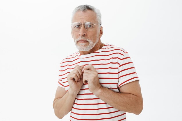 Bearded old man in striped Tshirt