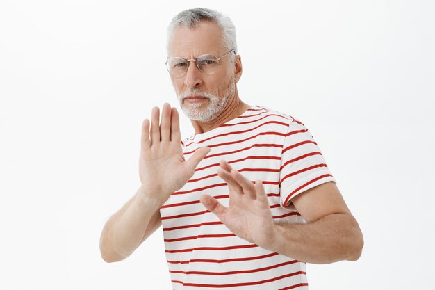 bearded old man in striped tshirt