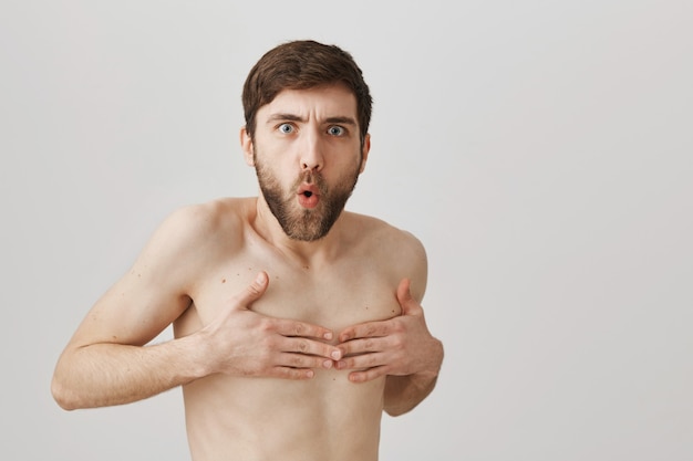 Bearded portrait of a young guy naked