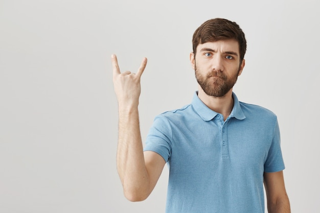 Bearded portrait of a young guy with blue Tshirt