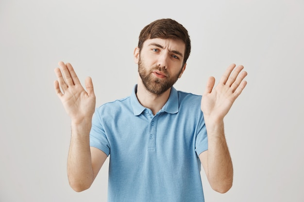 Bearded portrait of a young guy with blue Tshirt