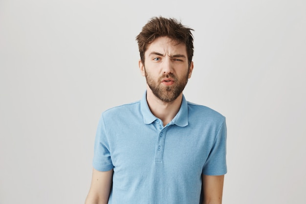Bearded portrait of a young guy with blue Tshirt