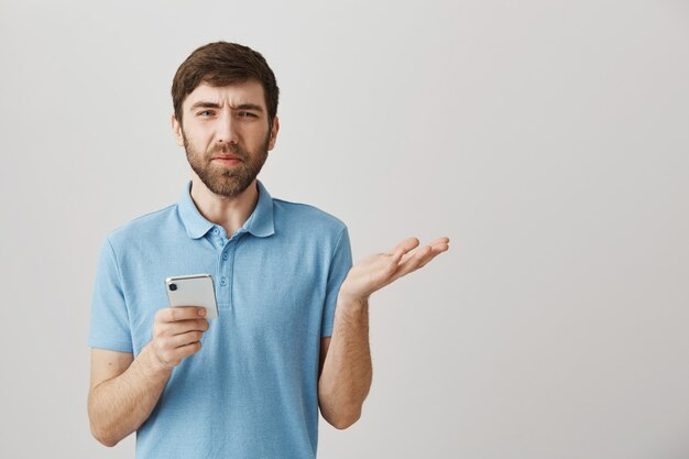 Bearded portrait of a young guy with blue Tshirt