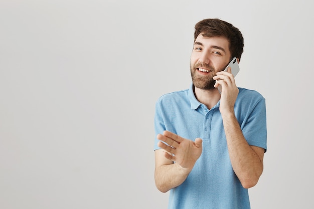 Bearded portrait of a young guy with blue Tshirt