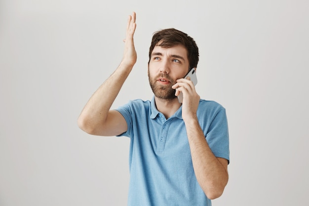 bearded portrait of a young guy with blue tshirt