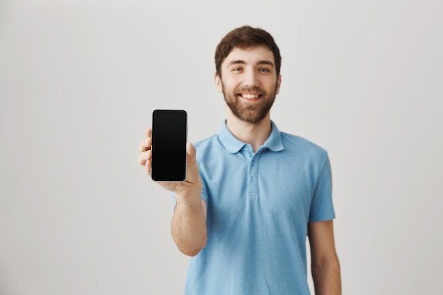 Bearded portrait of a young guy with blue Tshirt