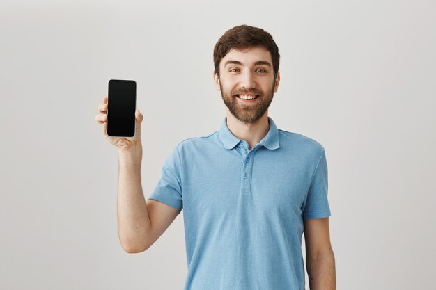 Bearded portrait of a young guy with blue Tshirt