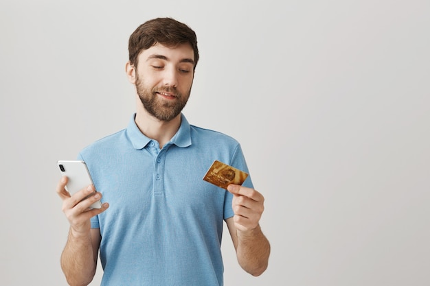 Bearded portrait of a young guy with blue Tshirt