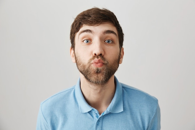 Bearded portrait of a young guy with blue Tshirt