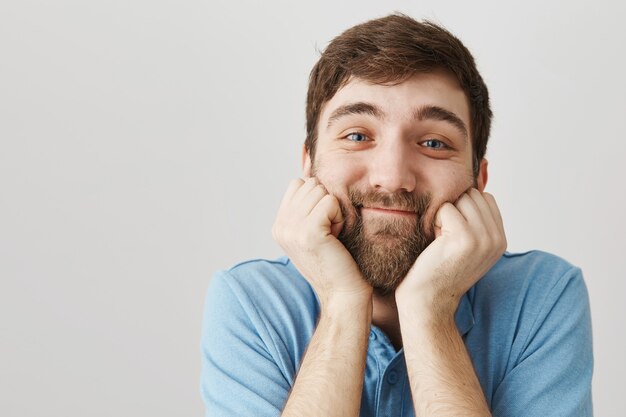 Bearded portrait of a young guy with blue Tshirt