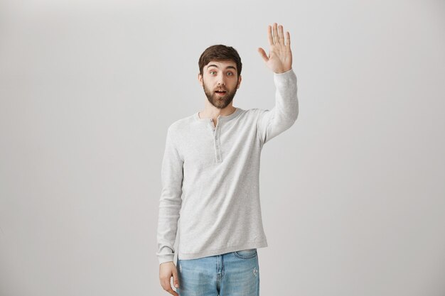 Bearded portrait of a young guy with a white blouse