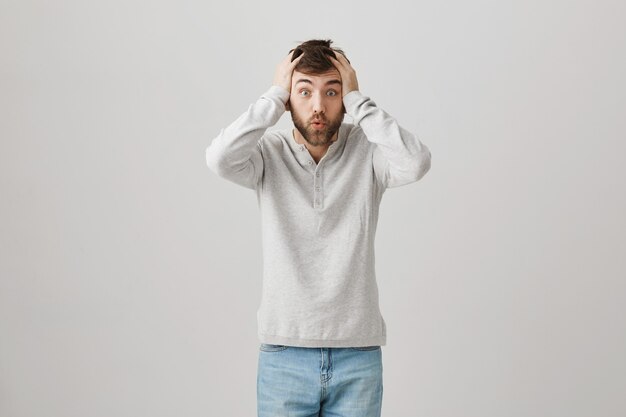 Bearded portrait of a young guy with a white blouse