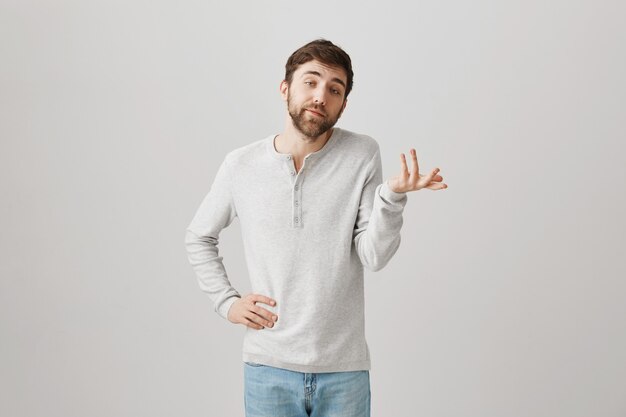 Bearded portrait of a young guy with a white blouse