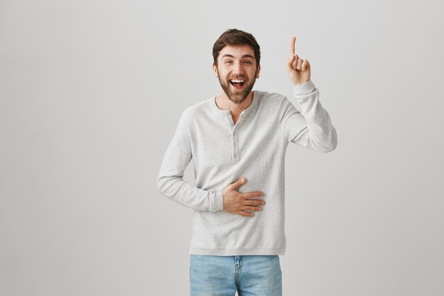 Bearded portrait of a young guy with a white blouse