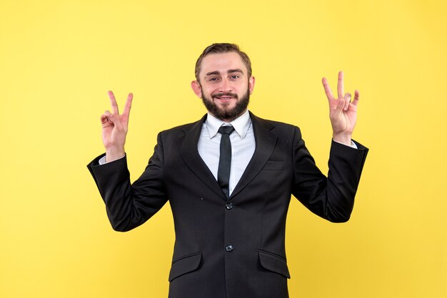 Bearded young man showing victory sign