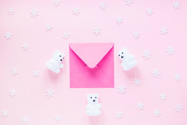 Bears and snowflakes around envelope