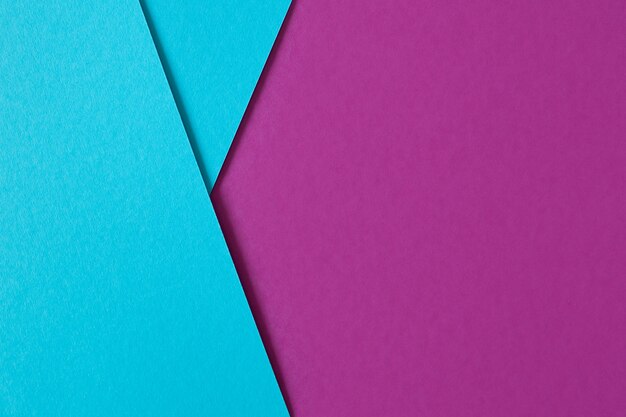 Beatiful geometric composition with blue and purple paperboard with copyspace