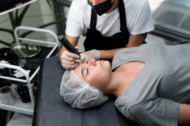 Beautician doing a microblading procedure